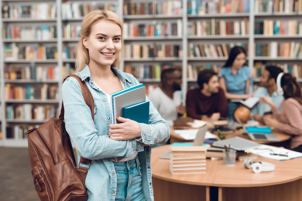 group-ethnic-multicultural-students-sitting-library-1